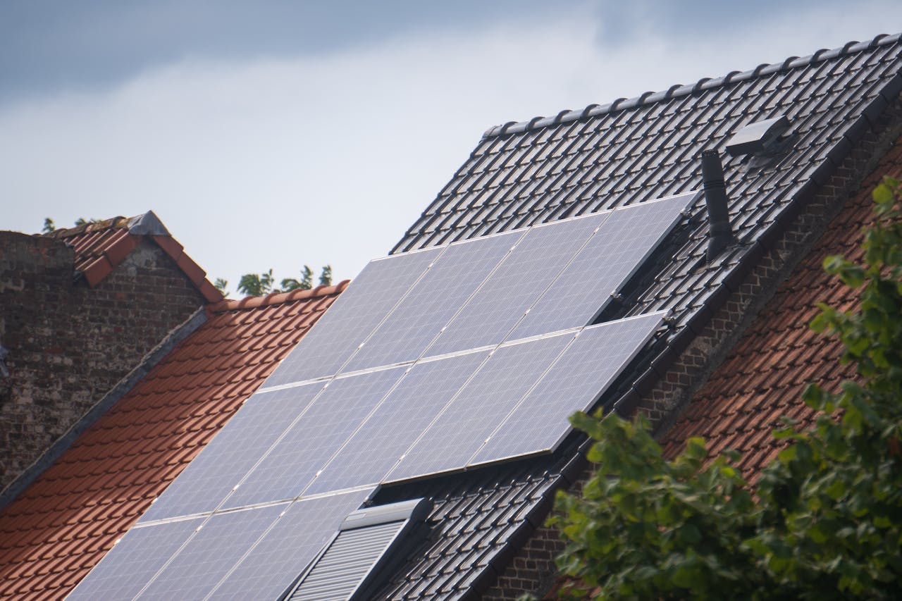 about-02 Solar panels installed on a residential rooftop, showcasing eco-friendly renewable energy solutions.